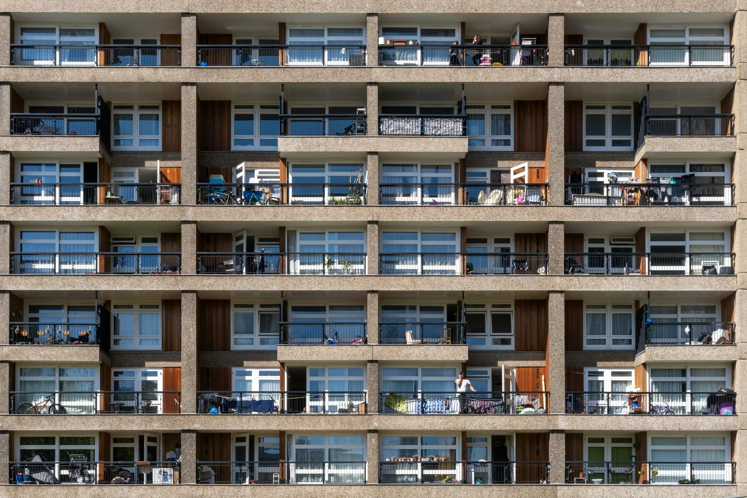 A block of flats with a regular grid of balconies and windows