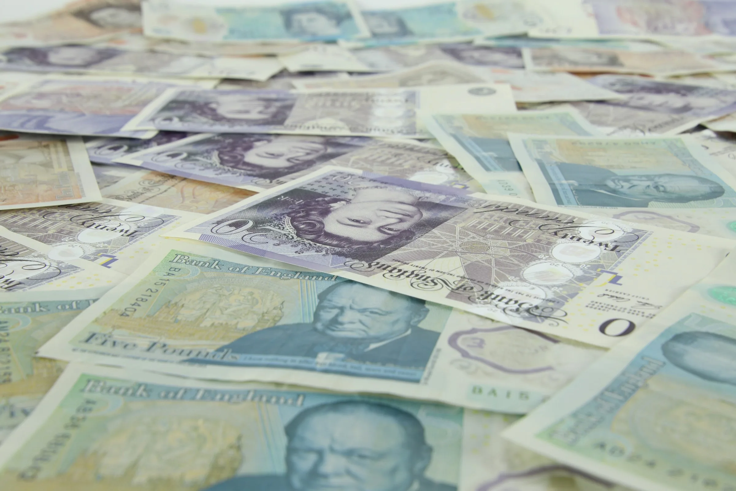 British banknotes scattered in a pile