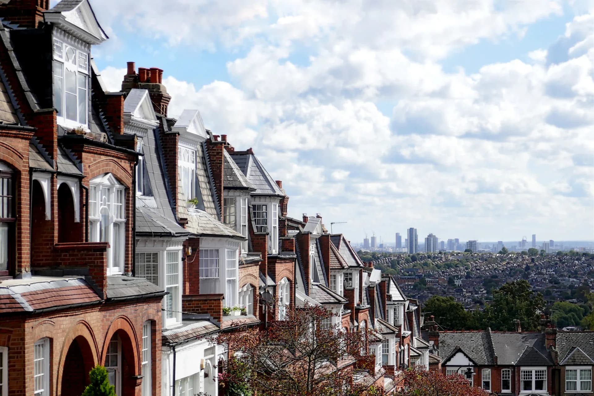 Stock photo of a row of London terraced houses, used as hero background imagery on the home, buying, selling and contact pages