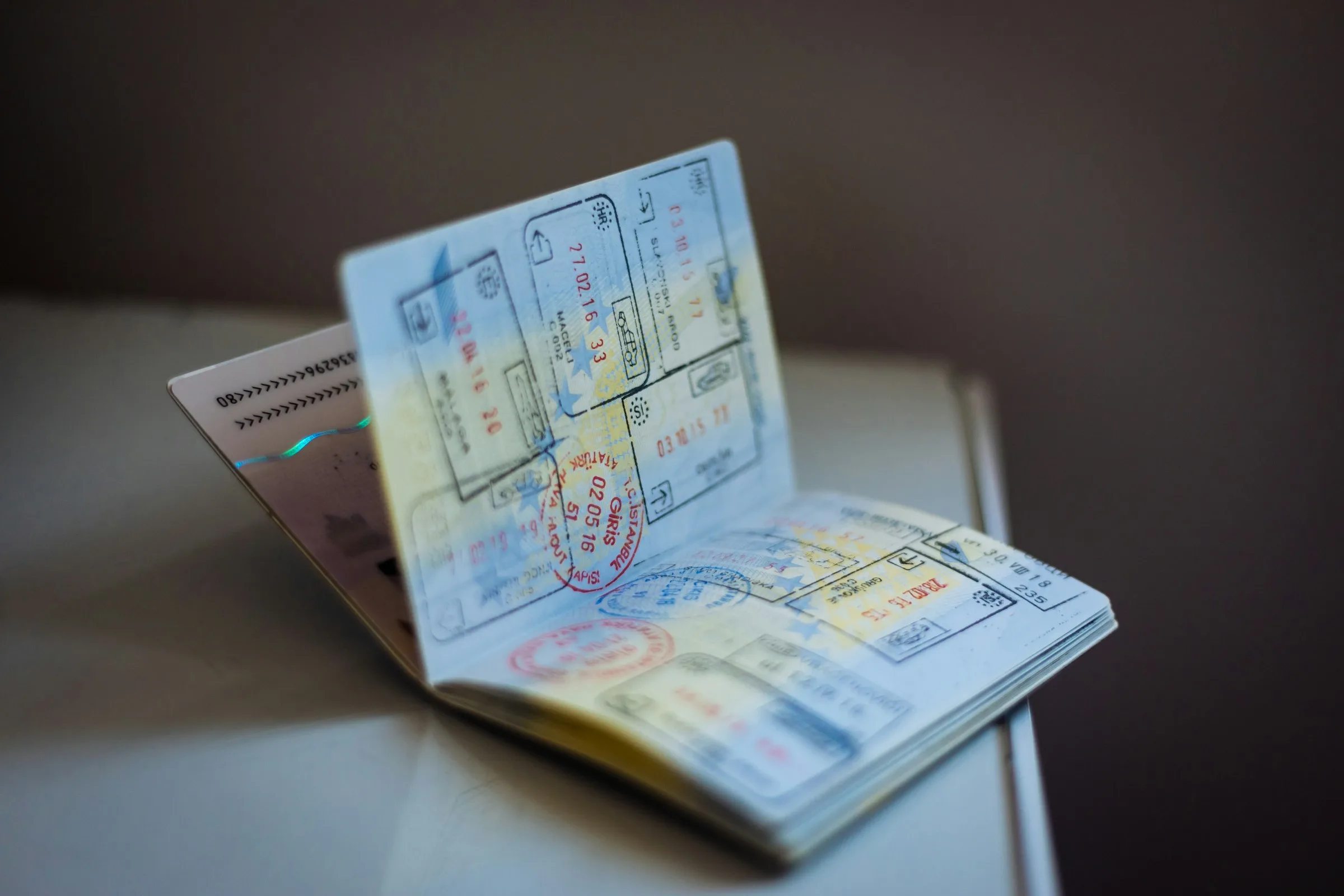 An open passport showing pages of travel stamps