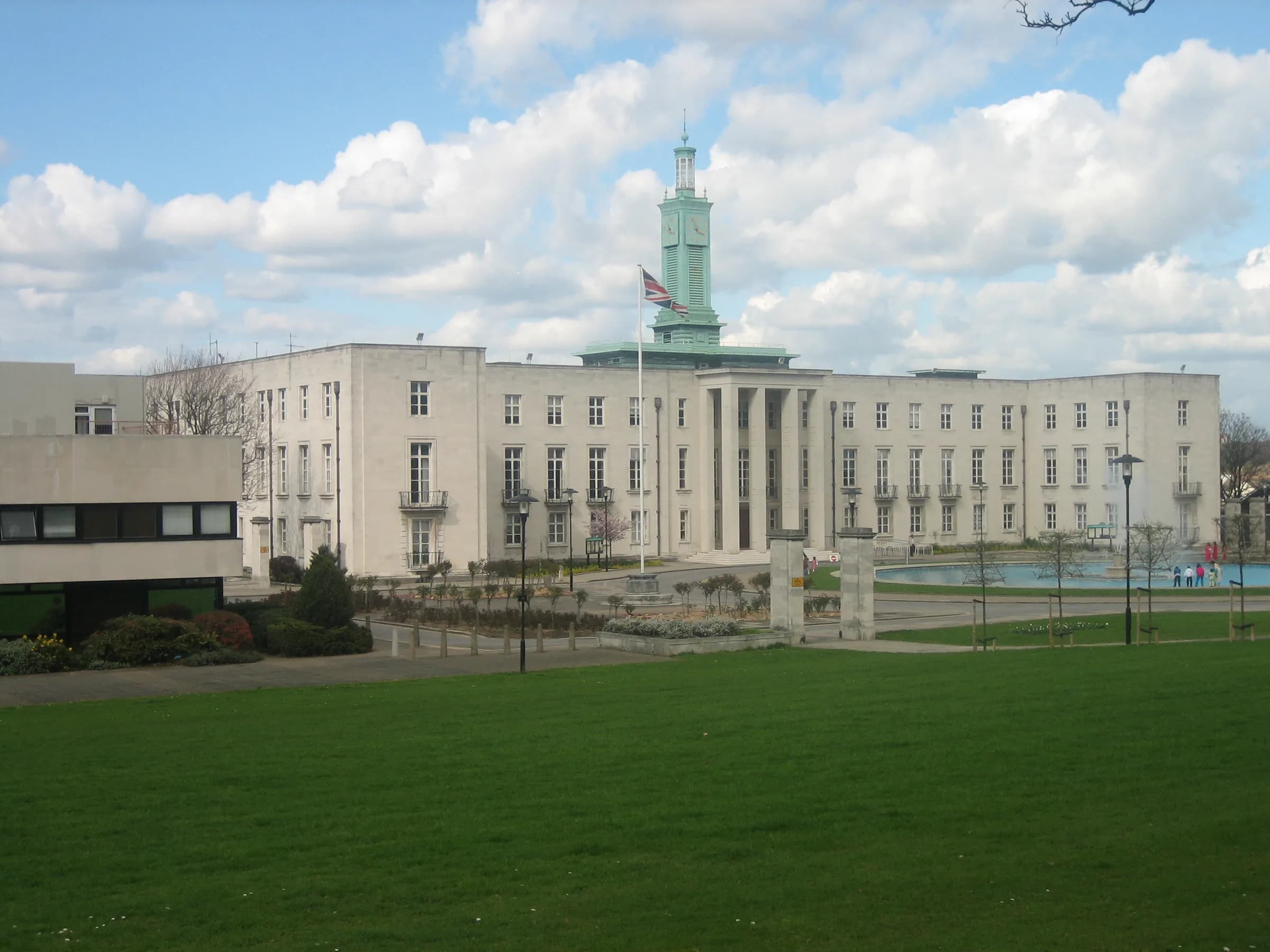 Waltham Forest Town Hall in Walthamstow, seen across the lawn under a bright sky