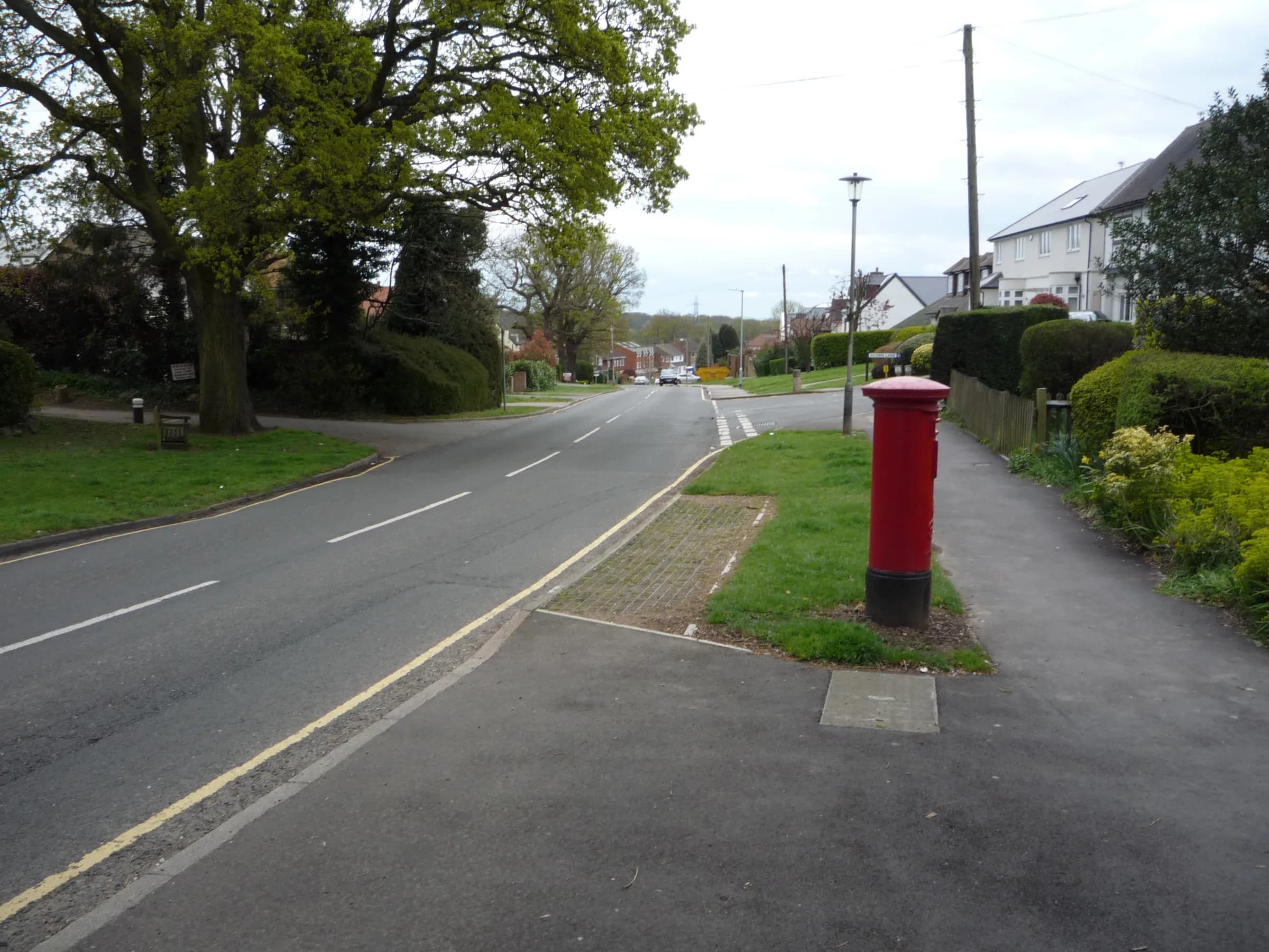 Tolmers Road in Cuffley, a tree-lined residential road with a red post box